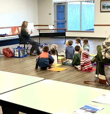 Youth Librarian reading at Storytime