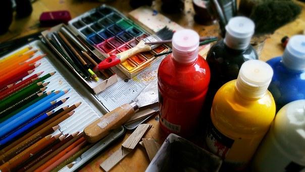 Painting supplies, pencils, and brushes